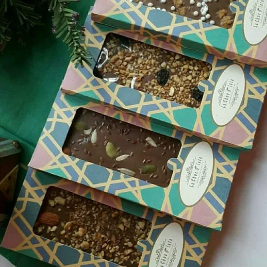La Chocolata artisan chocolate bars with nut and seed toppings